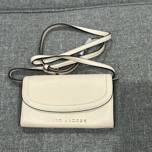 White/cream Marc Jacobs cell phone wallet bag.